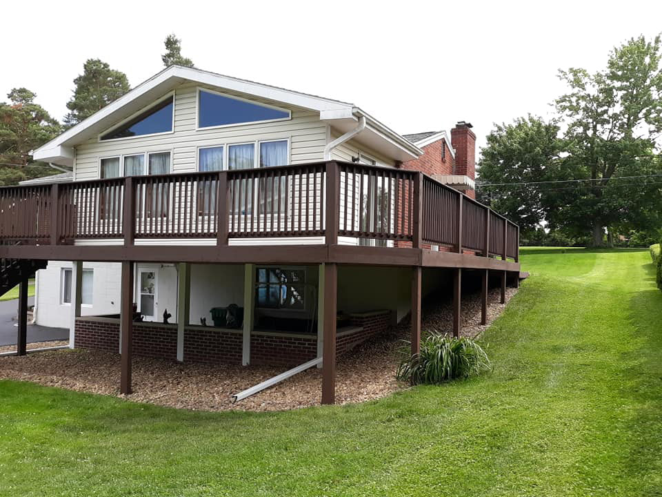 finished project of a raised wrap around 
deck