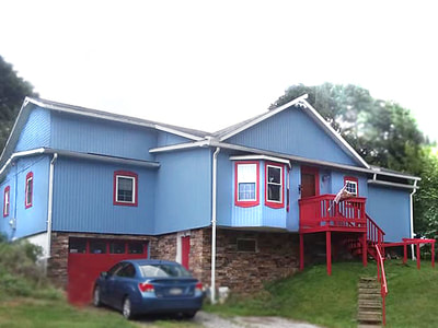 House painted blue with red trim