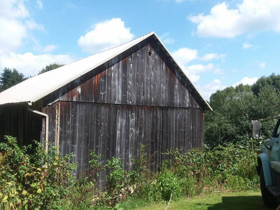 old barn in disrepair need of painting