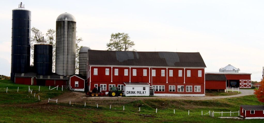 Barn painted red on large dairy farm