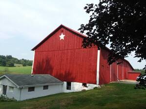 Barn painted red by Clair Boring