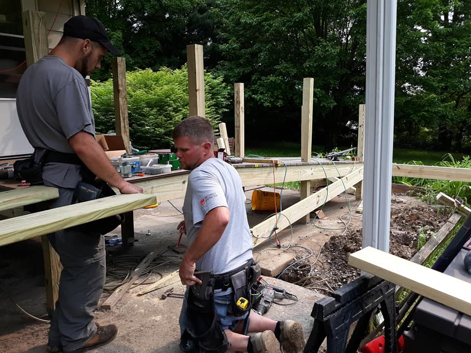 Men working on installing a handicap ramp